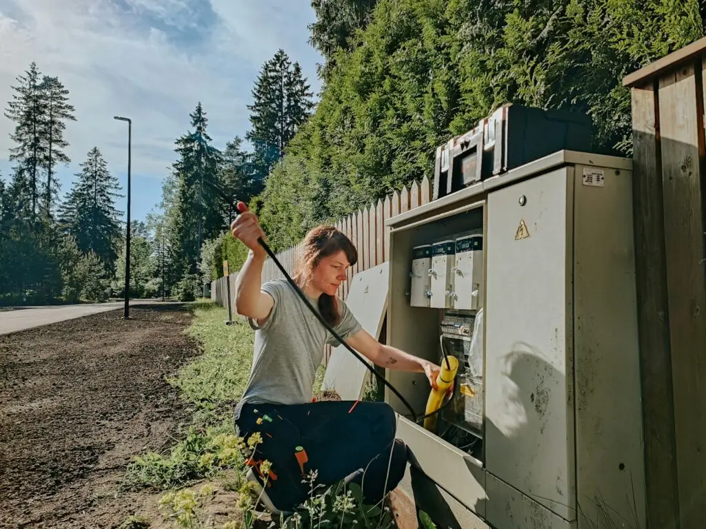 woman working on power box